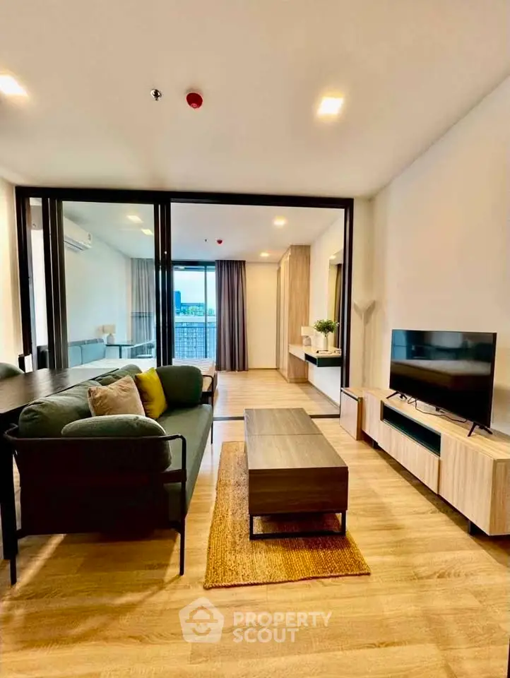 Modern living room with stylish furniture and large windows offering a stunning view.