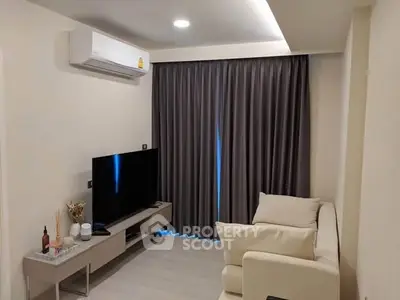 Modern living room with sleek furniture and air conditioning, perfect for cozy relaxation.