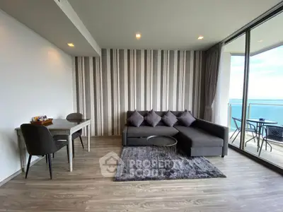 Modern living room with stylish decor and stunning ocean view from balcony