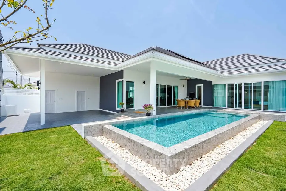 Luxurious modern villa with private pool and spacious outdoor area.