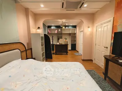 Charming bedroom with cozy decor and ample storage in a stylish home.