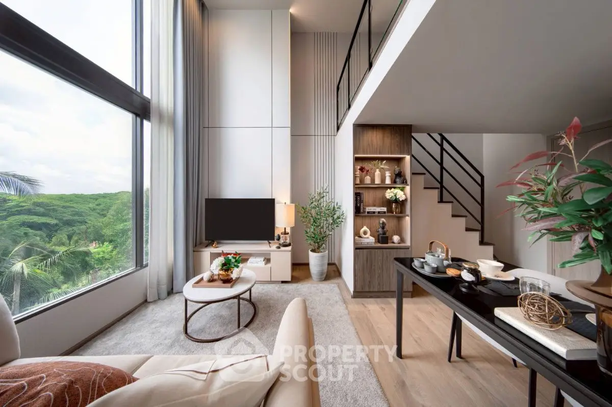 Luxurious modern living room with high ceilings and stunning forest view.