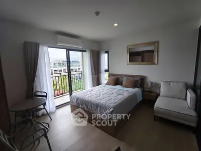 Modern bedroom with balcony view in stylish apartment