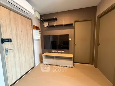 Modern living room with wall-mounted TV and sleek air conditioning unit