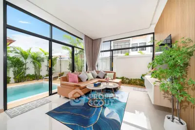 Luxurious living room with pool view and modern decor