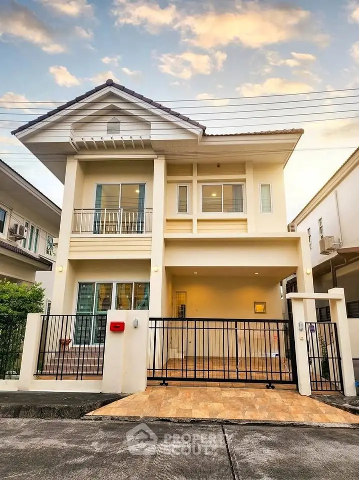 Charming two-story house with modern design and spacious driveway in a serene neighborhood.