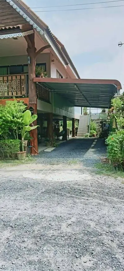 Charming two-story house with lush garden and spacious driveway