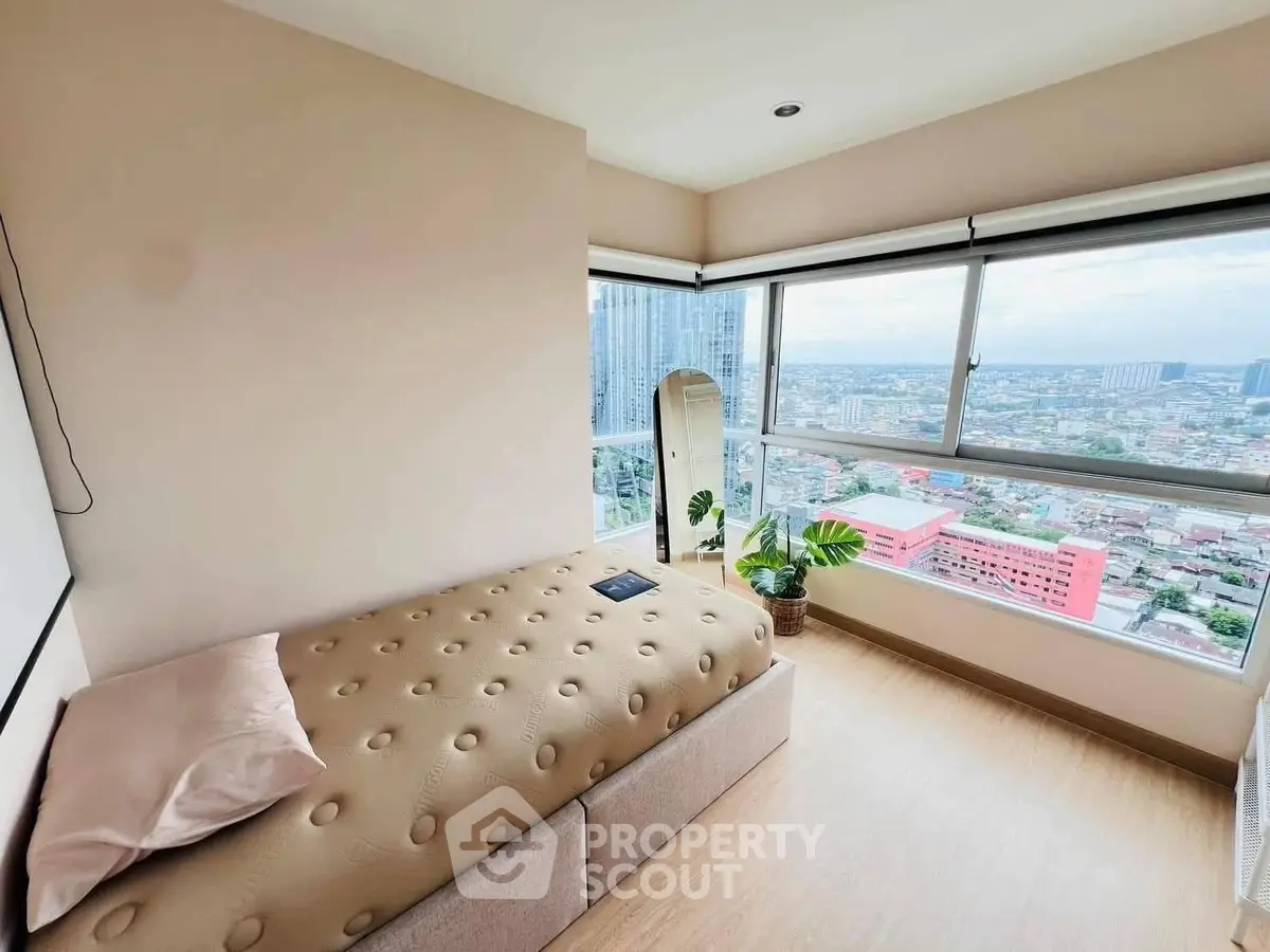 Bright bedroom with panoramic city view and modern decor