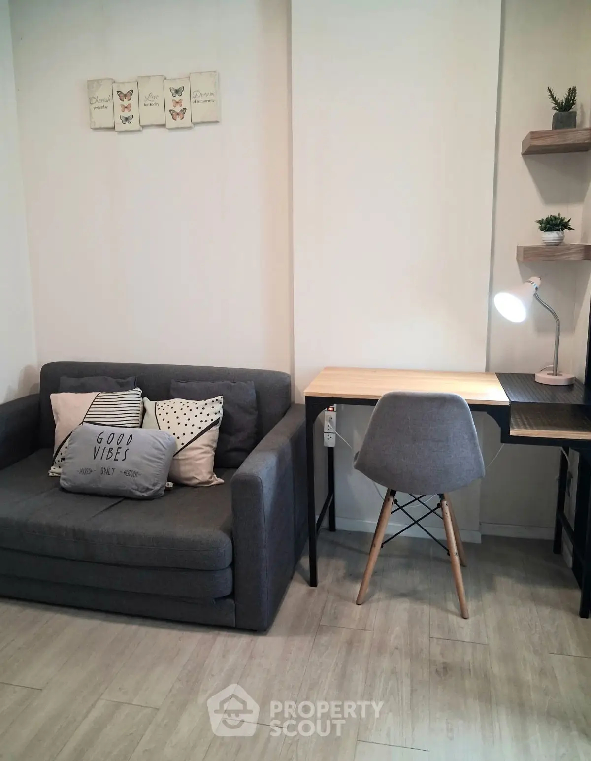 Cozy living room with modern sofa and stylish study desk