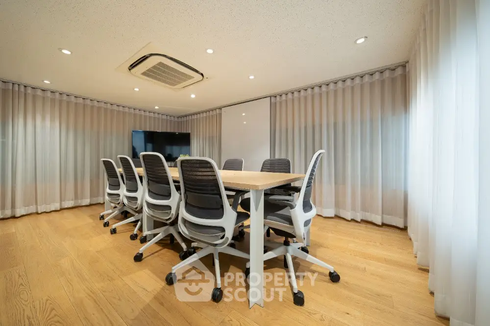 Modern conference room with sleek design and ample natural light