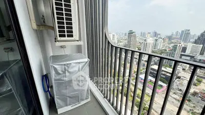 High-rise balcony with cityscape view and air conditioning unit