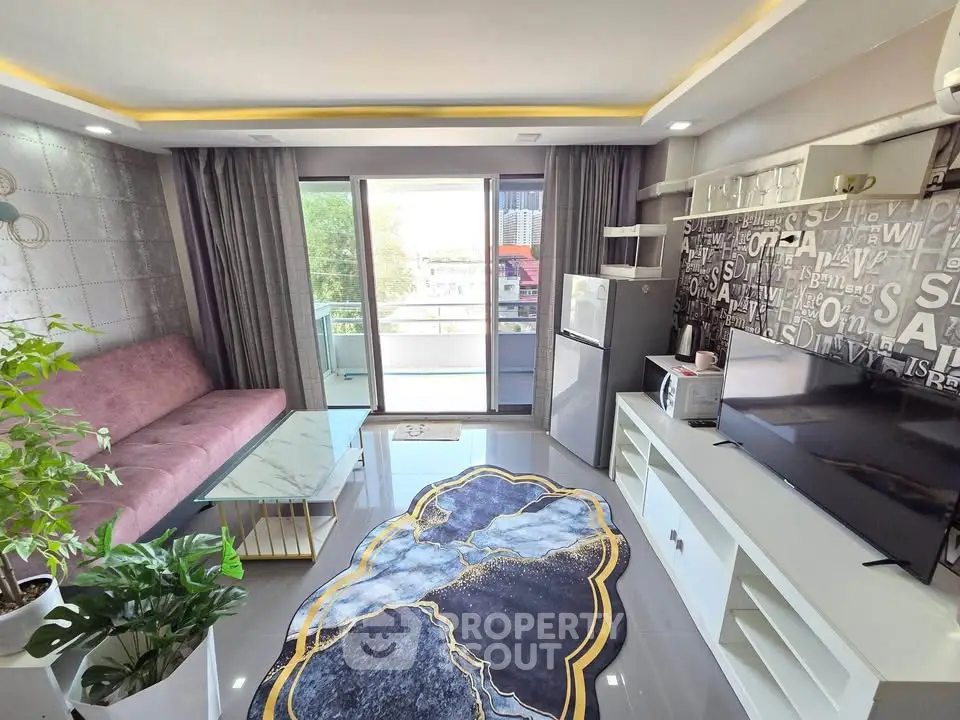 Modern living room with balcony, stylish decor, and natural light in urban apartment.