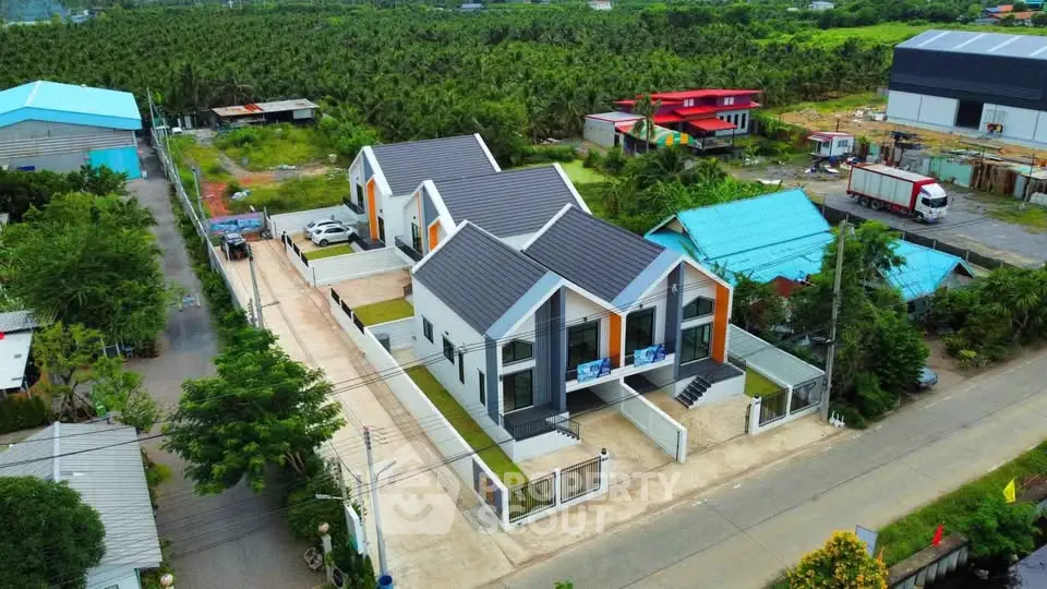 Modern duplex homes with sleek design in lush green surroundings, offering privacy and contemporary living.