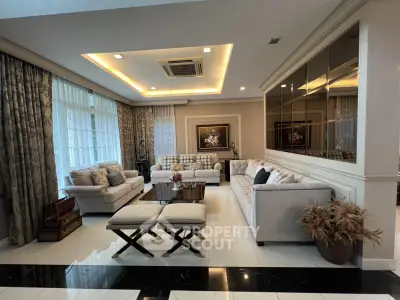 Luxurious living room with elegant decor and plush seating in a modern home.