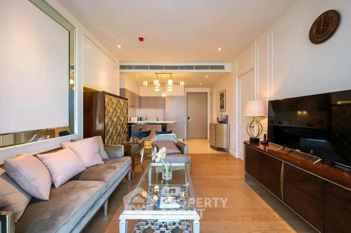 Luxurious modern living room with elegant decor and open kitchen layout.