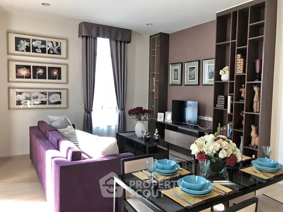 Stylish modern living room with elegant decor and vibrant purple sofa