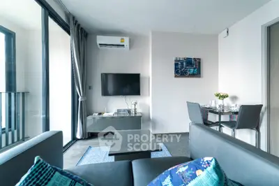 Modern living room with sleek furniture and balcony view