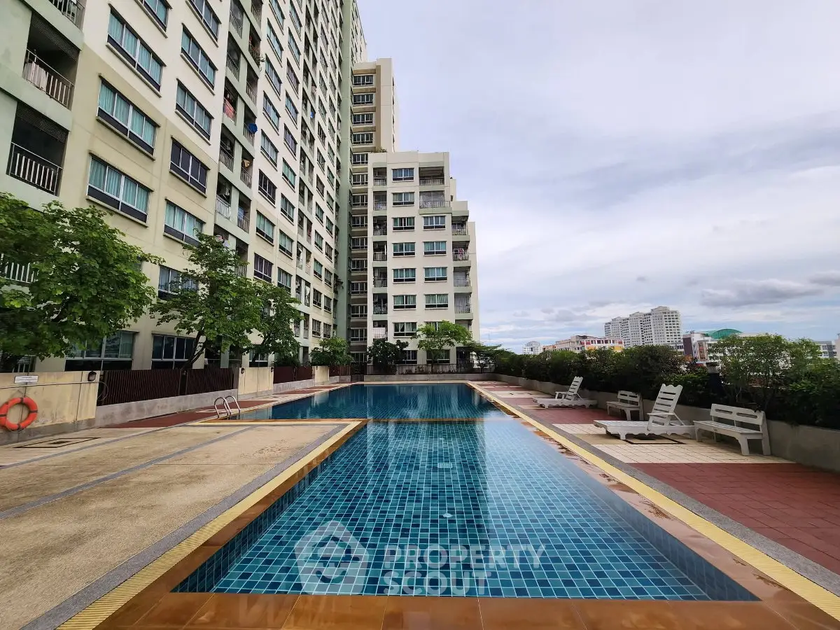Luxurious high-rise apartment with stunning pool and city views, perfect for urban living.