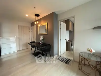 Modern living room with dining area and stylish decor in a cozy apartment.