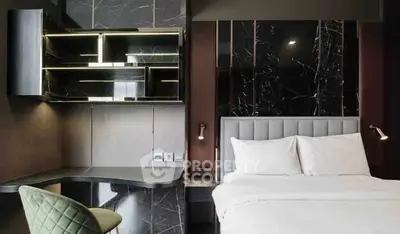 Luxurious modern bedroom with sleek black marble accents and elegant lighting