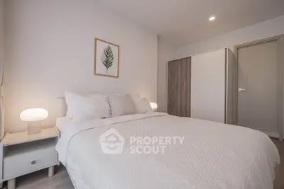 Modern bedroom with cozy white bedding and stylish decor