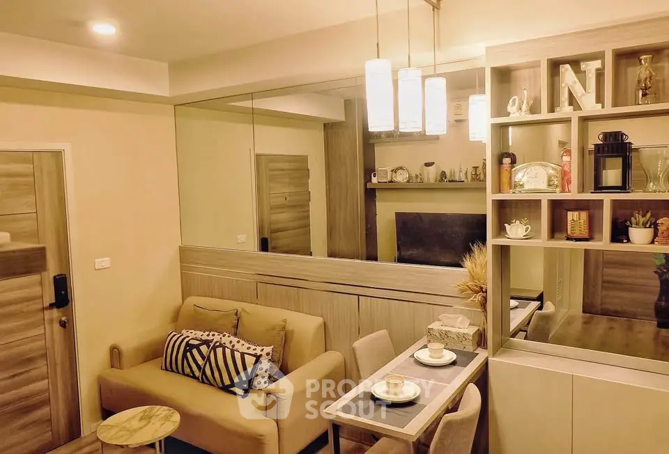 Cozy living room with modern decor and dining area, perfect for urban living.
