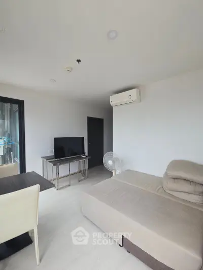 Modern living room with sleek furniture and air conditioning in a stylish apartment.