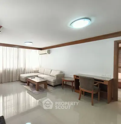 Spacious living room with modern furniture and natural light