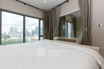 Luxurious bedroom with stunning city view and large windows in modern apartment