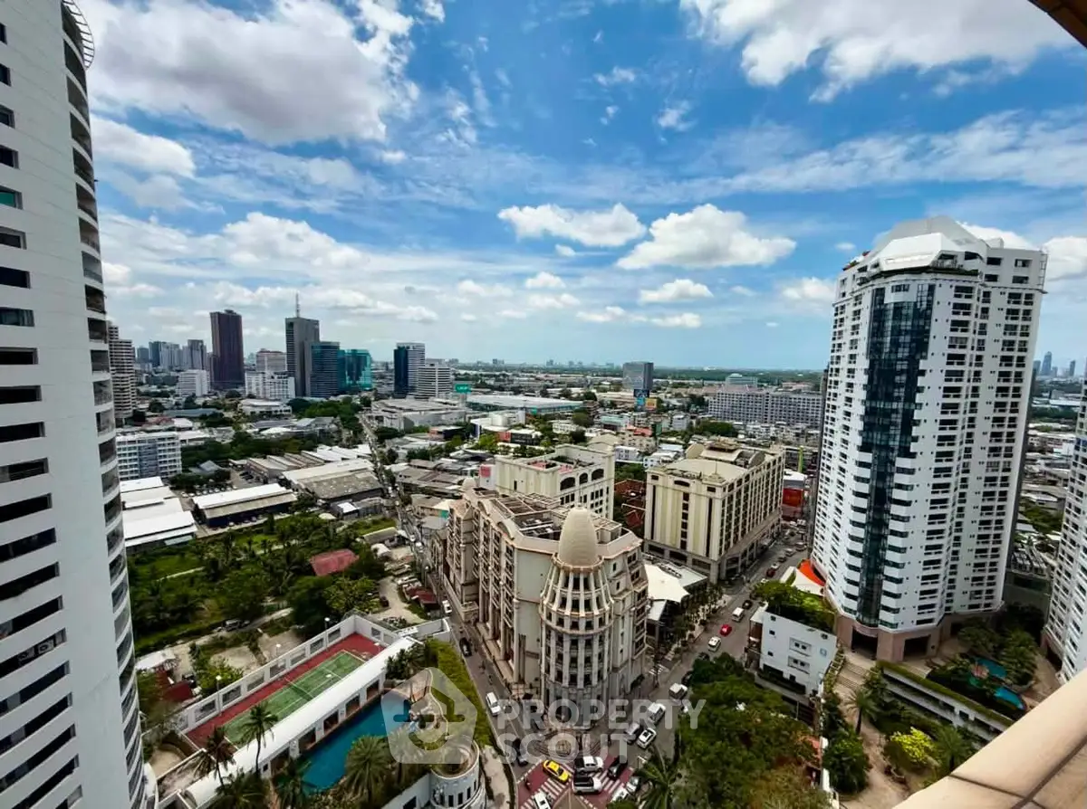 Stunning cityscape view from high-rise balcony with modern architecture and vibrant skyline.