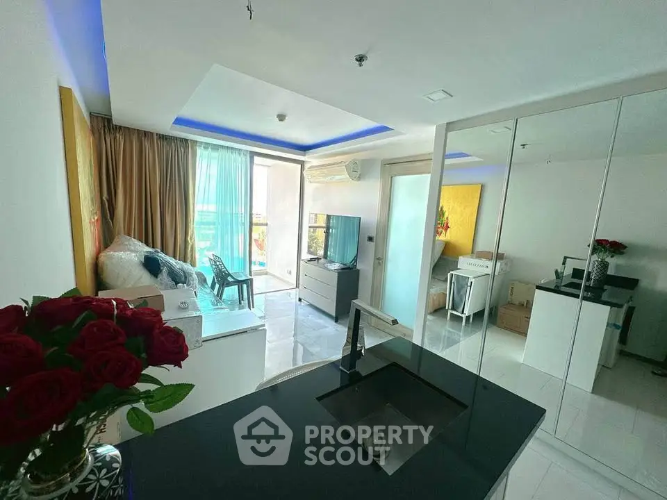 Modern living room with sleek design and balcony view