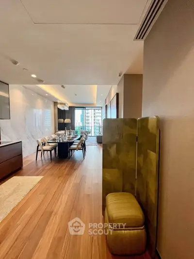 Luxurious modern living room with elegant dining area and city view.