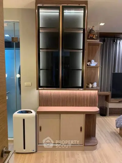 Modern living room with stylish wooden cabinet and air purifier, perfect for contemporary home decor.
