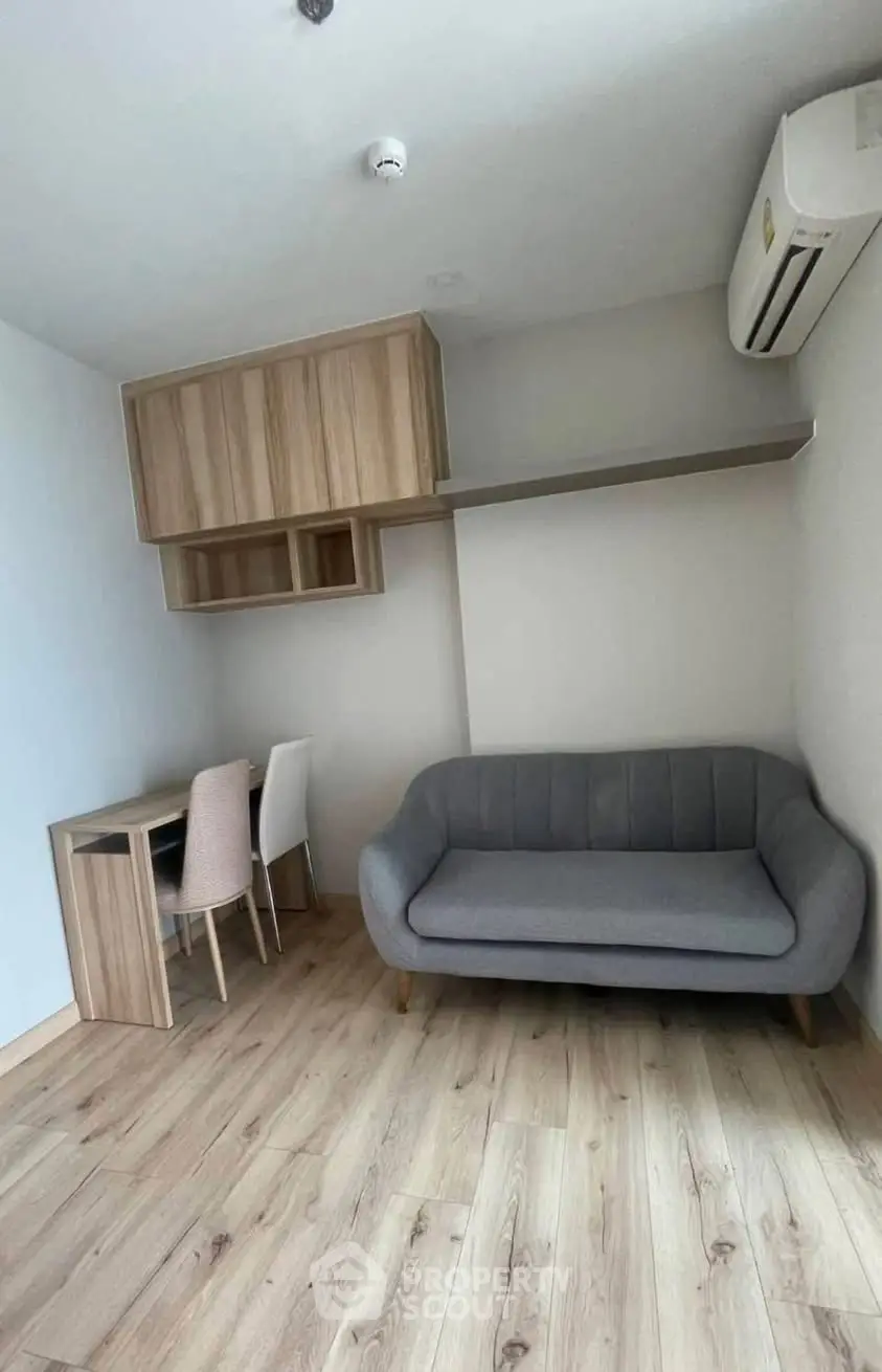 Modern living room with stylish sofa and wooden flooring