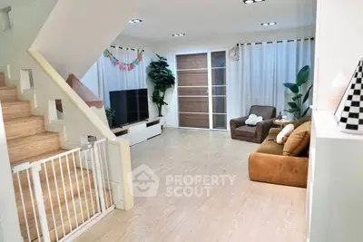 Spacious modern living room with stylish decor and ample natural light