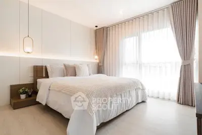Luxurious bedroom with modern decor and natural light