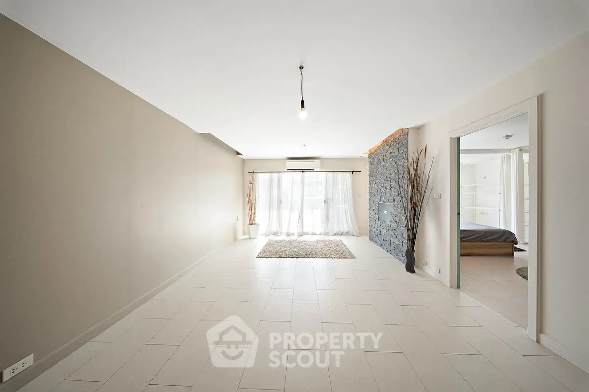 Spacious modern living room with natural light and minimalist design