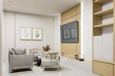 Modern living room with sleek furniture and wall-mounted TV in a stylish apartment.