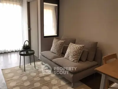 Cozy living room with modern sofa and stylish decor in a bright apartment