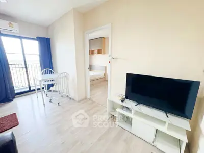 Bright living room with modern decor and balcony access in a stylish apartment.