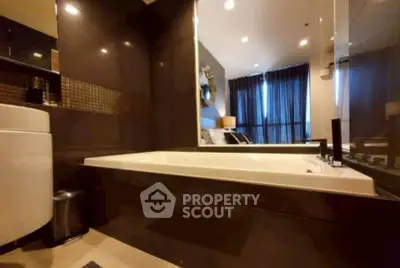 Luxurious bathroom with modern bathtub and elegant decor in a stylish apartment.