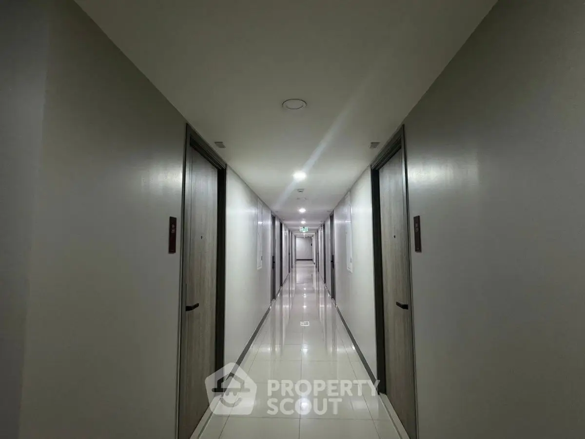 Modern apartment hallway with sleek design and polished floors