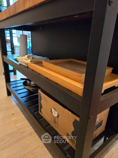 Modern kitchen storage shelf with wooden trays and boxes, ideal for organized living spaces.