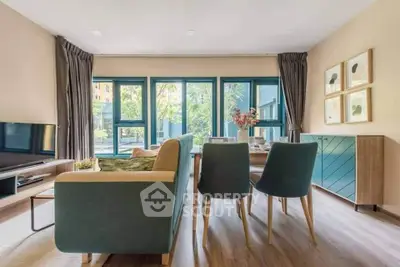 Modern living room with stylish furniture and large windows offering a bright, inviting atmosphere.