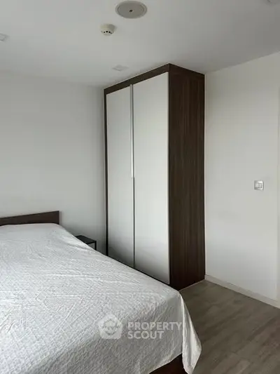 Modern bedroom with sleek wardrobe and minimalist design