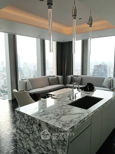Luxurious modern living room with panoramic city views and elegant marble kitchen island.