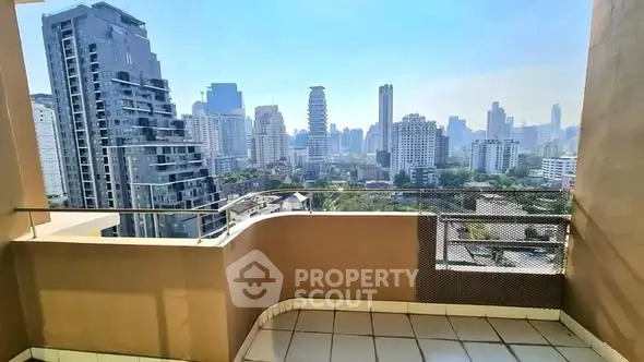 Stunning cityscape view from a high-rise balcony in a modern urban setting.