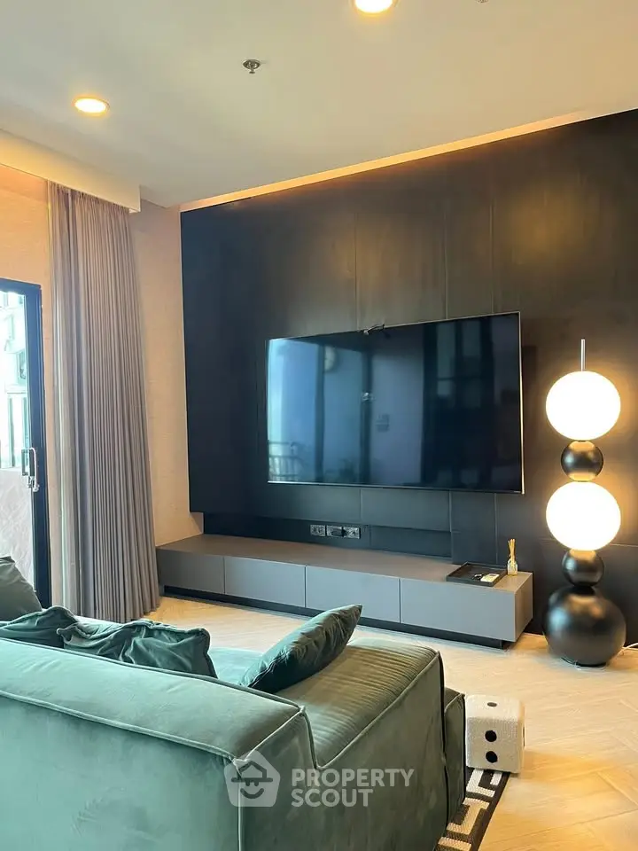 Modern living room with sleek TV setup and stylish lighting