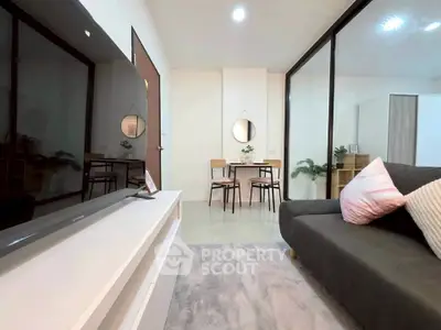 Modern living room with sleek furniture and stylish decor, perfect for urban living.