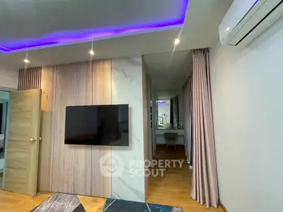 Modern living room with stylish decor and ambient lighting